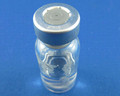 A see-through vial with no cap that has a sticky residue where a label was apparently removed.