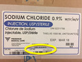 This is an image of the product label attached to the side of the product box. There is a yellow oval at the bottom of the label circling the Lot number and expiry date to show the where this information can be found on the box.