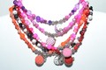 Junior girls' necklaces with button and bird charm pendants and matching bracelet